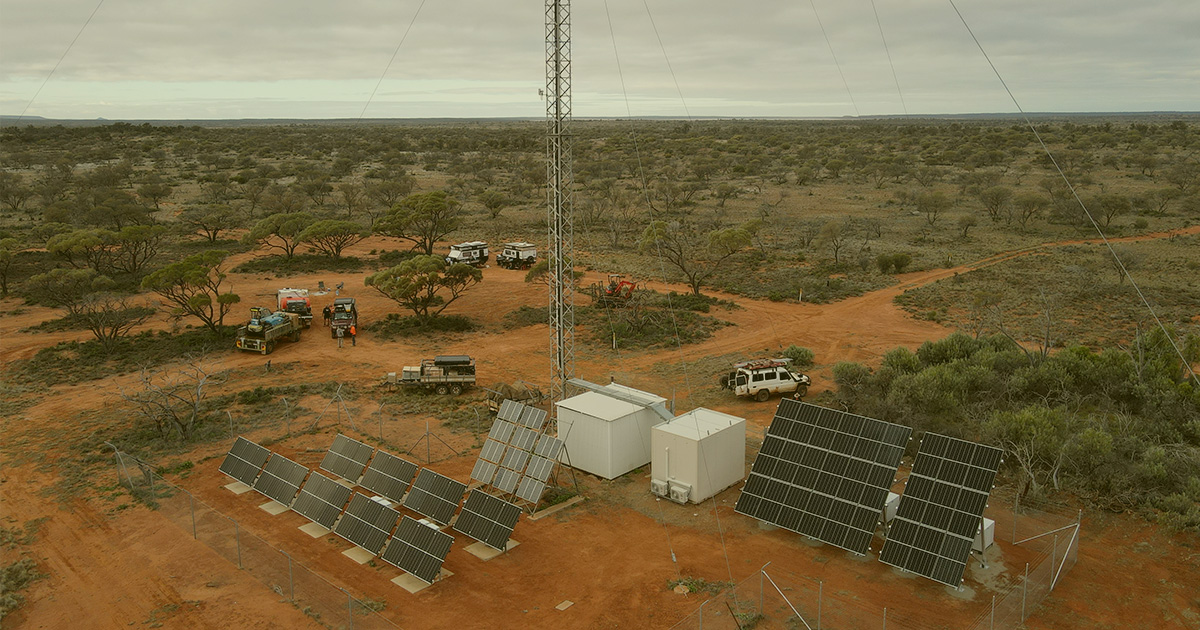Off grid solar hybrid system with solar panels beside a desert road for Australian Rail Remote Telecommunication Link Upgrades project.