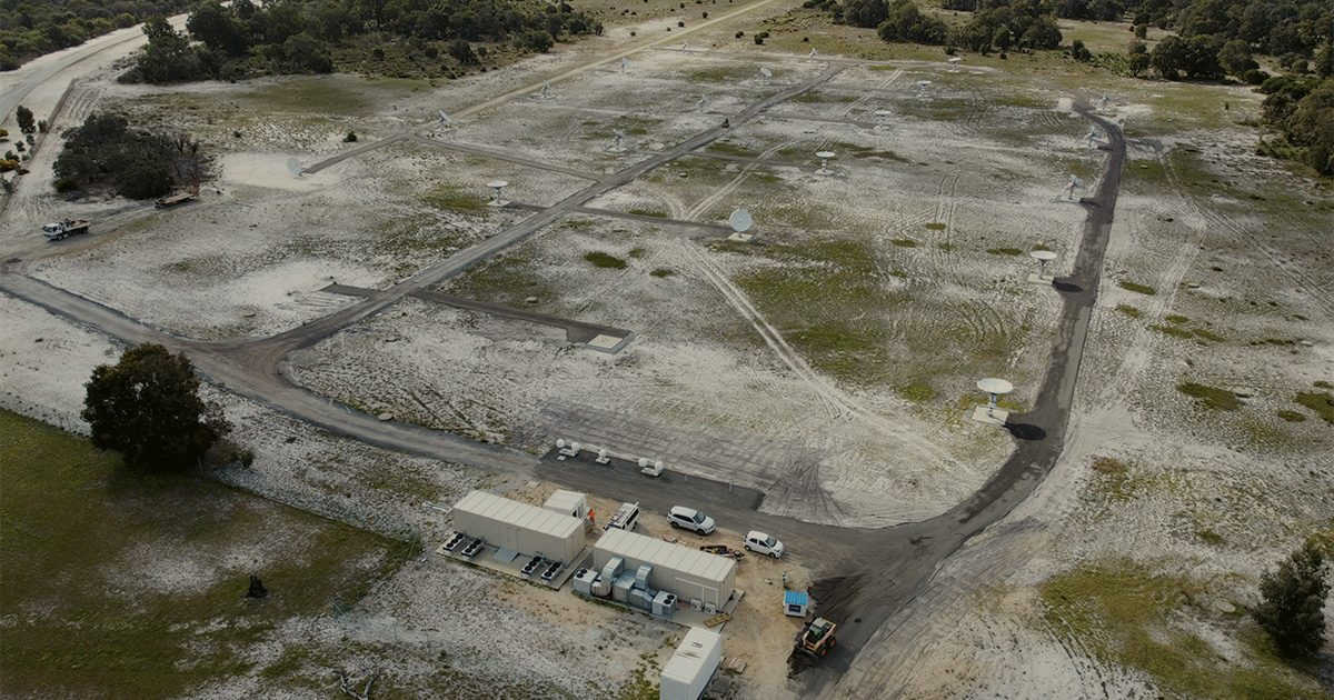 Aerial view of Perth International Communications Centre with surrounding trees and grounds for Critical Power Systems infrastructure.