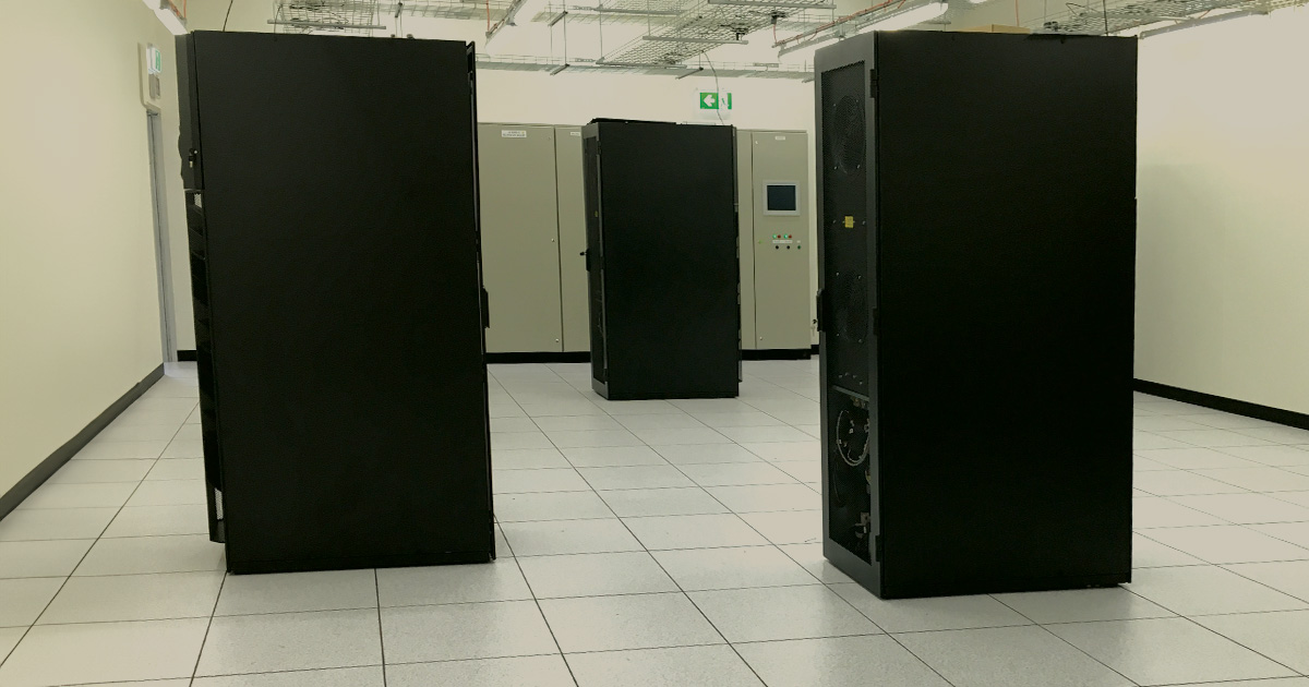 Spacious data centre with rows of black servers supporting advanced data storage and processing for data centre construction at PITC