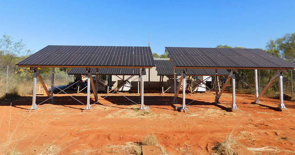 Solar panels in a desert landscape supporting off grid solar hybrid power systems across SA, WA and NT.