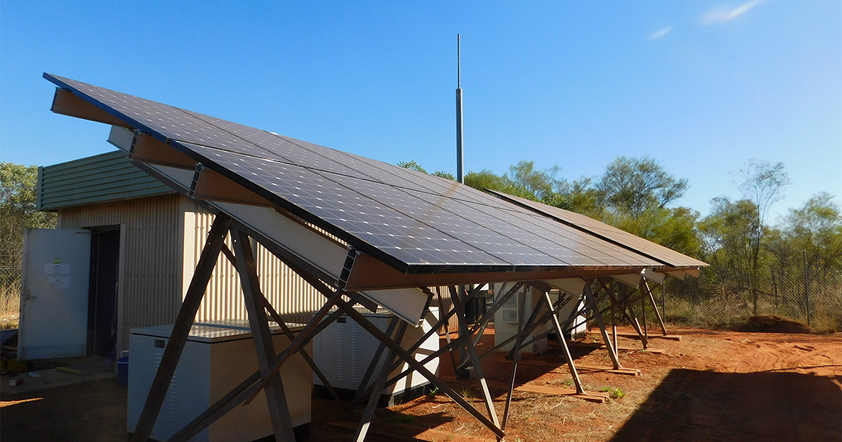 Solar panels in a desert landscape supporting off grid solar hybrid power systems across SA, WA and NT.