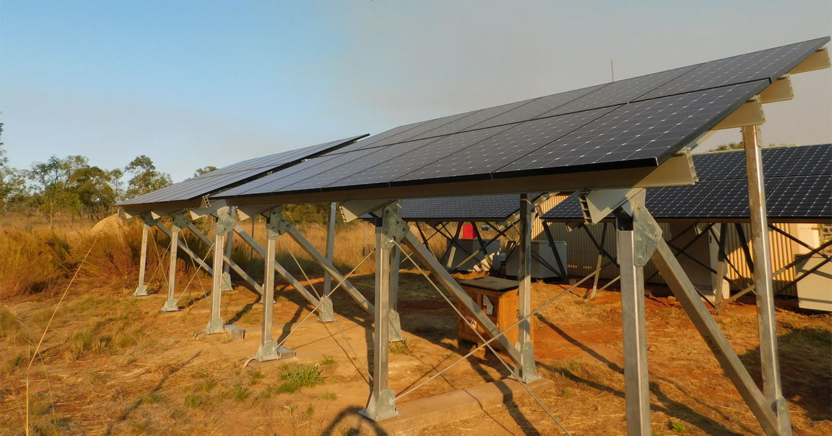 Solar panels in a desert landscape supporting off grid solar hybrid power systems across SA, WA and NT.
