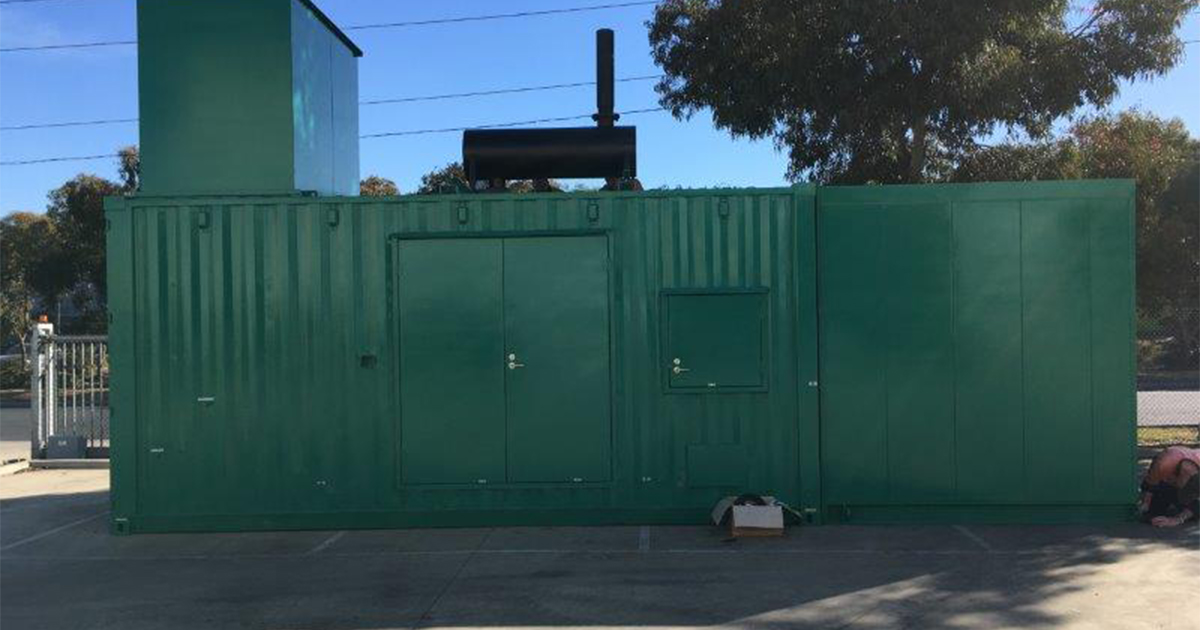 Off-grid solar hybrid system with a green container and chimney for energy generation at the Geraldton TE.