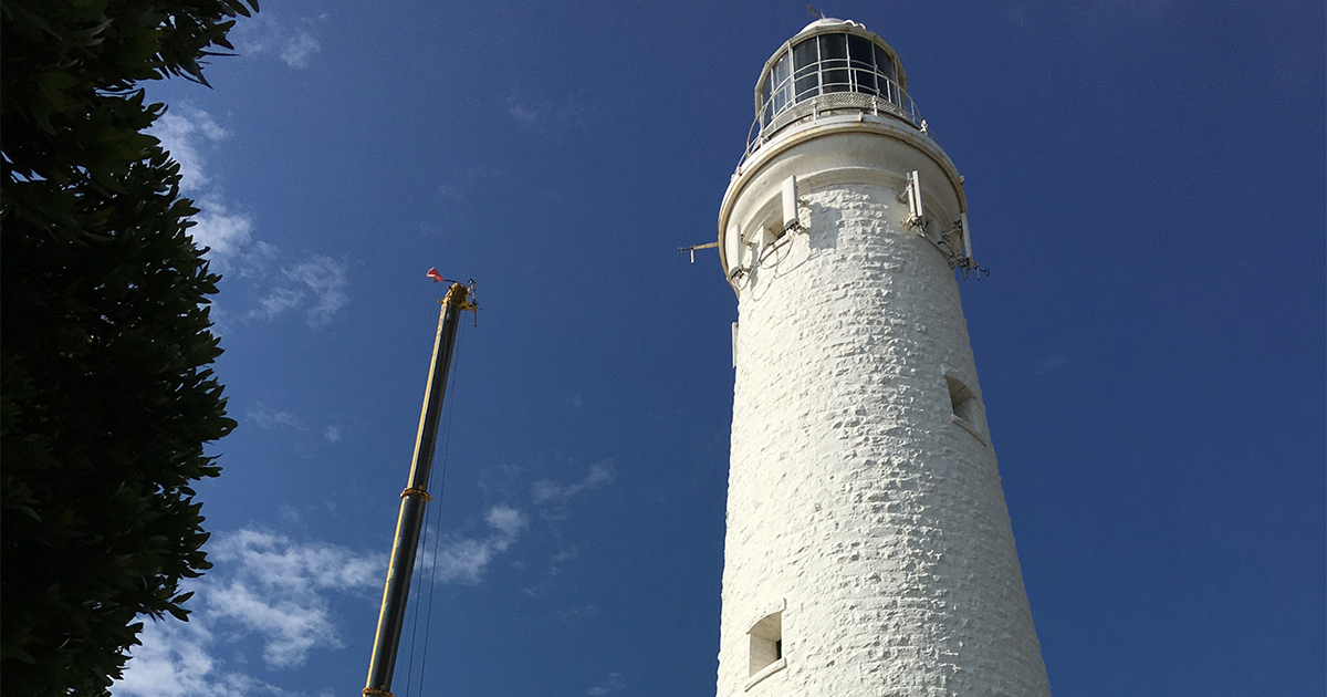Rottnest Island Lighthouse under a clear blue sky, supported by backup power systems installed by DCE Electrical.