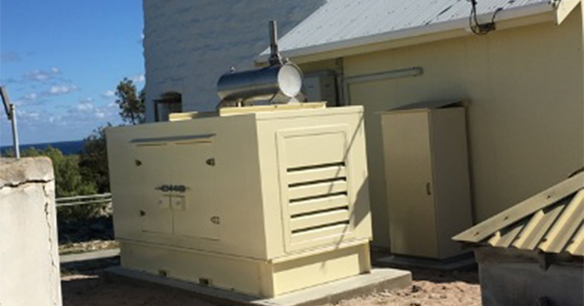 Large white generator providing backup power systems for emergency energy supply at Rottnest Island Lighthouse.
