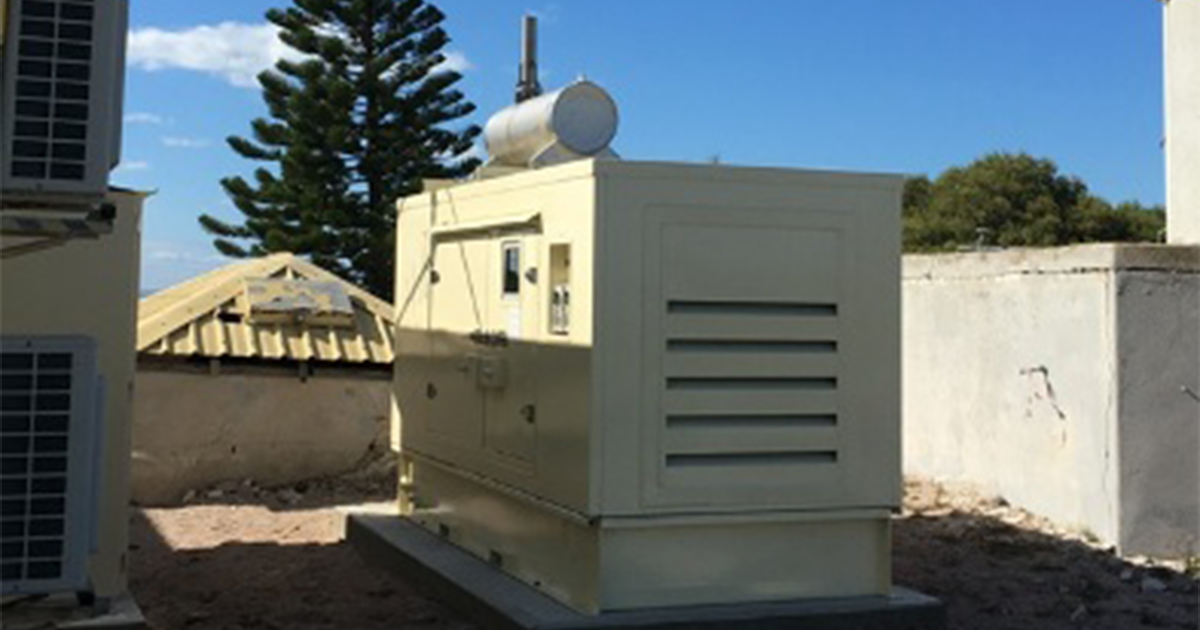 Large white generator providing backup power systems for emergency energy supply at Rottnest Island Lighthouse.
