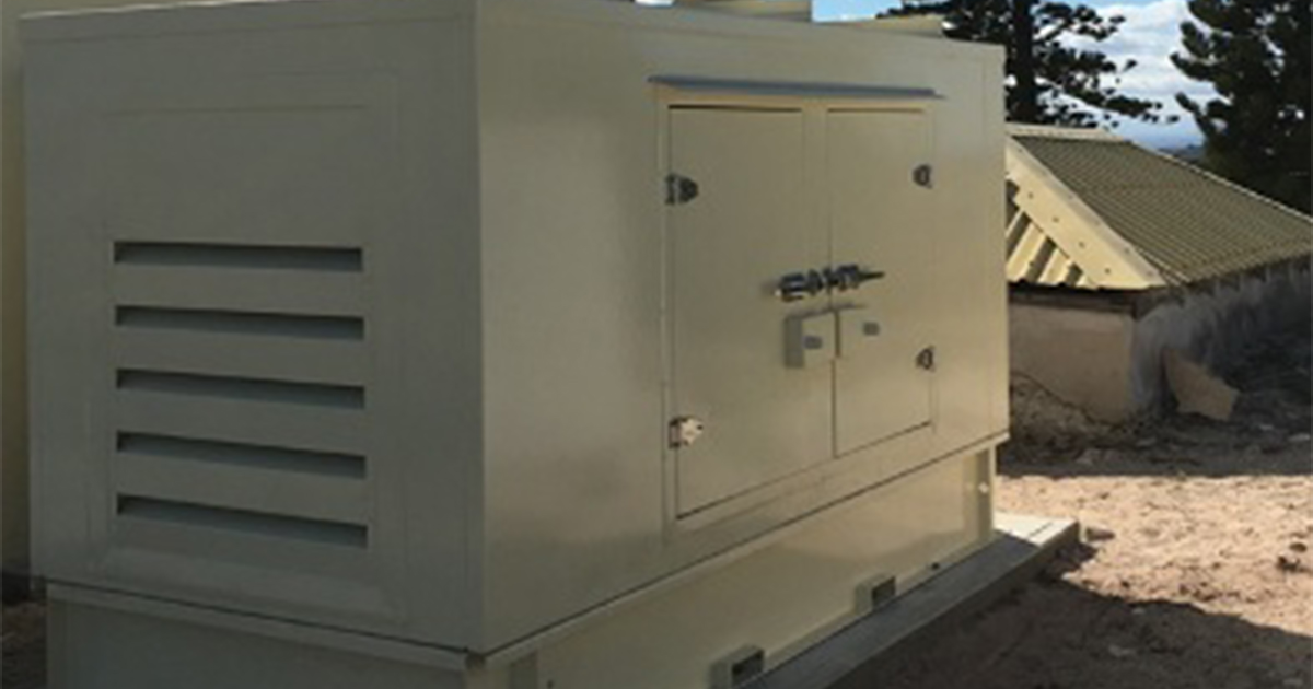 Large white generator providing backup power systems for emergency energy supply at Rottnest Island Lighthouse.